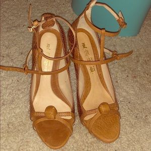 L.A.M.B brown snake skin Felix Sandles.
$.
